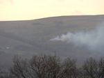 FZ004035 Fire on hill across campsite.jpg